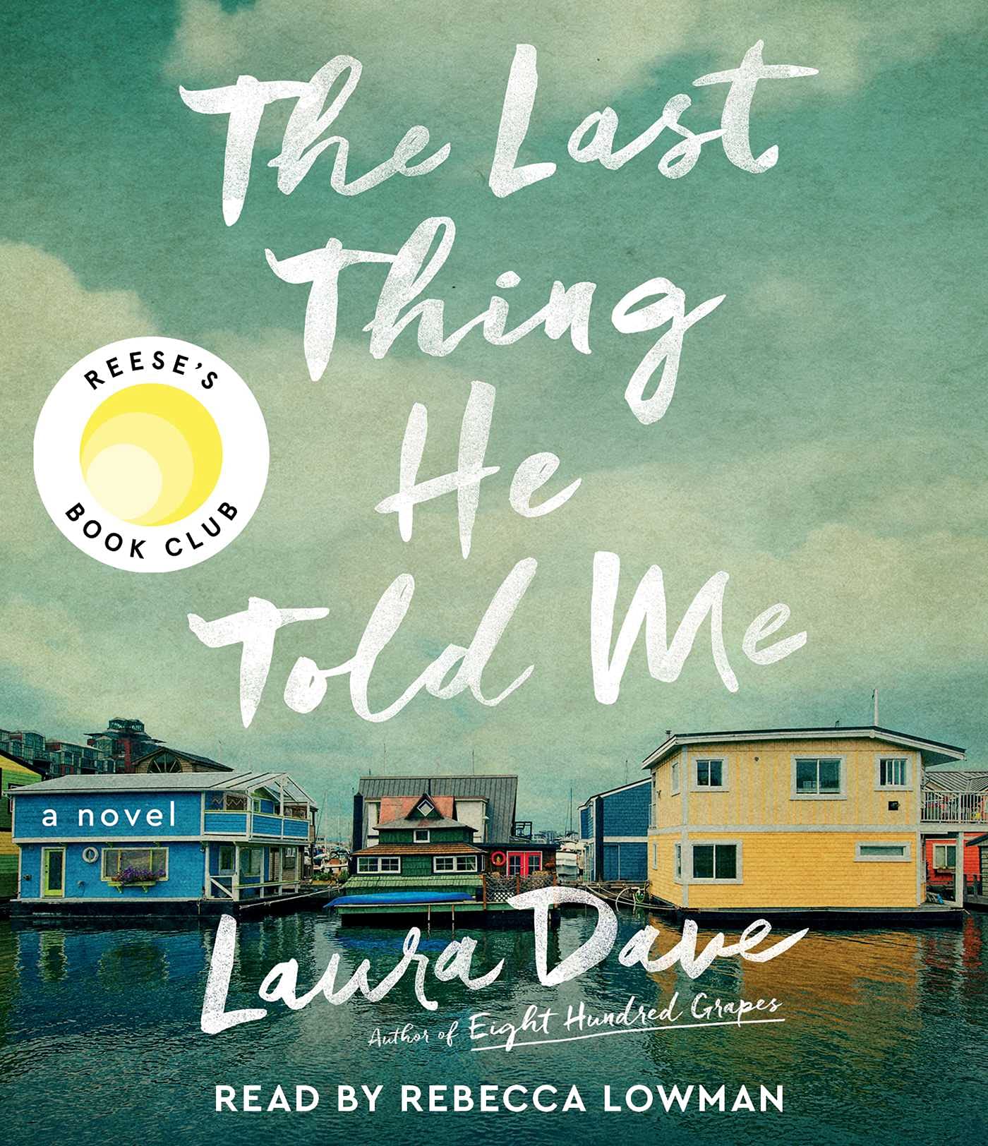 The Last Thing He Told Me by Laura Dave book cover with a few small houses on the water below a cloudy sky