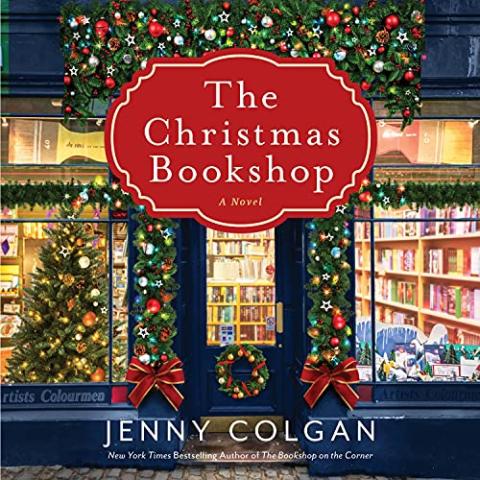 The Christmas Bookshop by Jenny Colgan book cover with the picture of a bookshop from the outside with Christmas lights and decorations on the outside and in the windows.