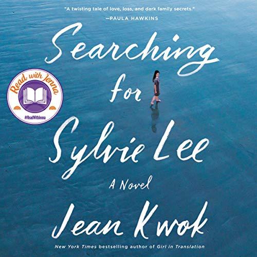 Searching for Sylvie by Jean Kwok book cover with the title and author in white letters across an ocean blue background and a woman walking past the word for.